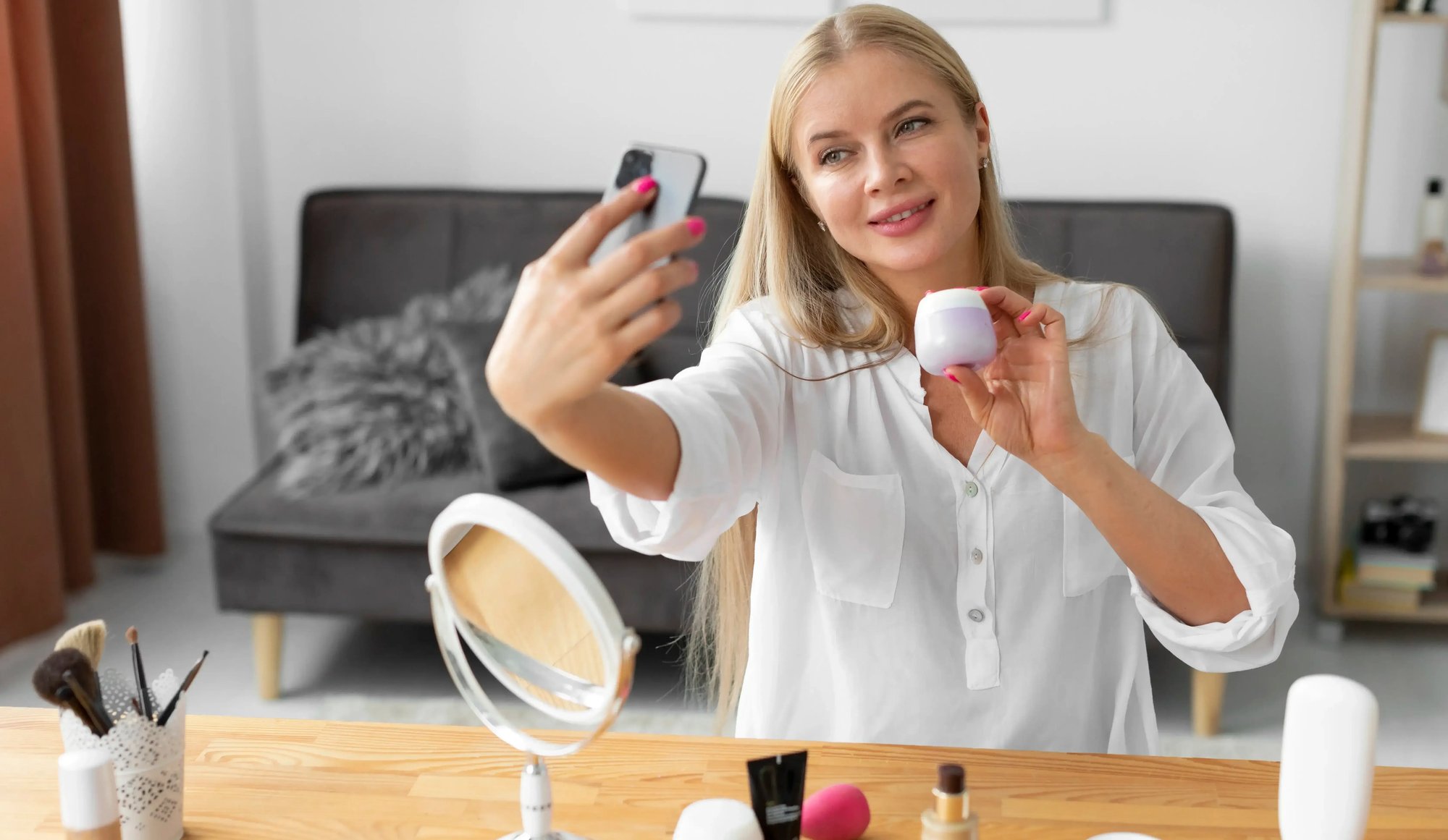 medium-shot-woman-holding-smartphone-1-1